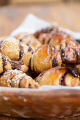 Croissants with chocolate and seeds. They look delicious. Sweet bakery