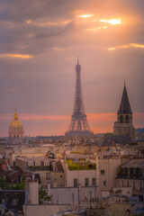 Fototapeta na wymiar Eiffel tower and parisian roofs at sunrise Paris, France