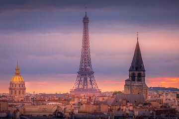 Eiffel tower and parisian roofs at sunrise Paris, France