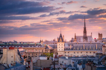 Saint Chapelle and quarter latin roofs at golden sunrise Paris, France