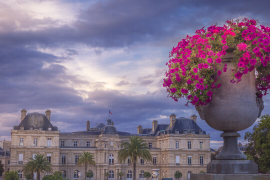 Luxembourg gardens with flowers vase and dramatic sky, Paris, France