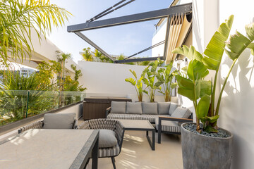 Hotel resort apartment terraces with armchairs and table