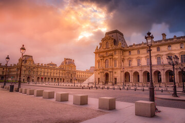 Fototapeta na wymiar Louvre street lights from Tuileries and dramatic sky, Paris, France