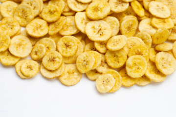 Banana slice chips on white background.