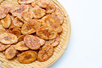 Banana chips on white background