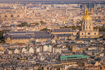 Fototapeta na wymiar Les Invalides and parisian roofs at golden sunrise Paris, France