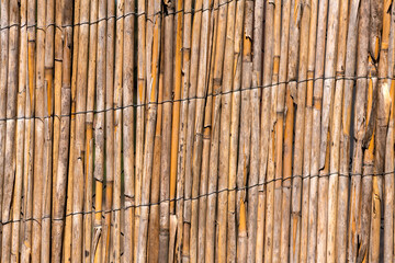 Old reed texture wallpaper background. Woven straw texture.