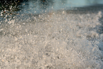 Frothy water splash in river or lake, abstract background.