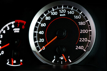 Close up fuel meter gauge shows the fuel level while in use of car