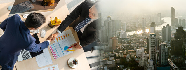Group business people handshake at meeting table in widen view in office together with confident...