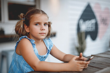 portrait of a girl sitting on the table