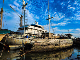 broken old wooden boat in the harbor