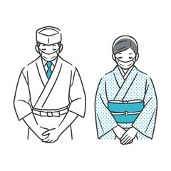 お辞儀をする和食店の店員（マスク姿）