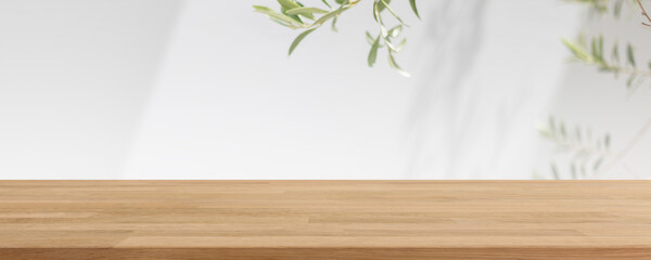 Empty wood table top and blurred white wall in garden background with Green leaves - can used for display or montage your products. - 521748147