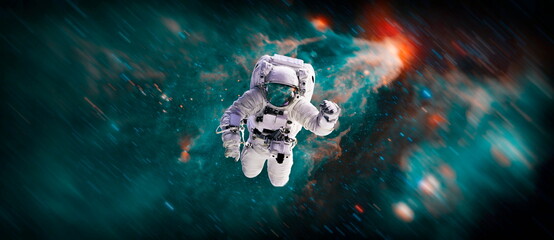 Picture of astronaut spacewalking with glowing stars . Astronaut in outer space. Elements of this...