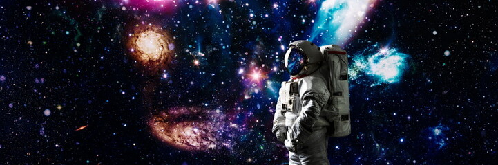 Picture of astronaut spacewalking with glowing stars . Astronaut in outer space. Elements of this...