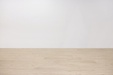 Background of Empty White Wall with Wooden Floor
