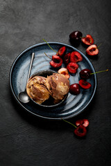 Chocolate ice cream with berries on dark background