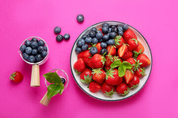 Strawberries on color background.