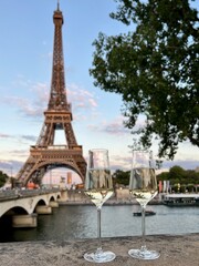 Fototapeta na wymiar Glasses of white wine with Eiffel Tower