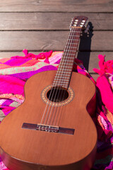 Obraz premium Music Lifestyle. Guitar on wooden boards and pink textile on a bridge. outdoors. 