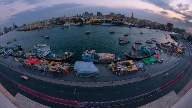 Time lapse of boats or abras crossing and sailing in Dubai creek one of tourist destination in Bur Dubai