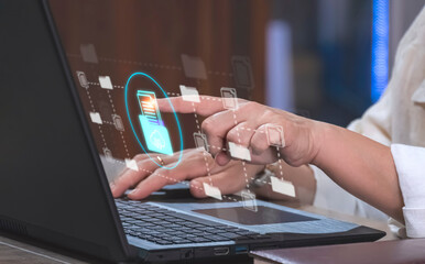 Businesswoman using laptop and touching on internet cloud document storage technology icon virtual screen with document management system, Concept of process automation to efficiently manage files