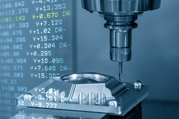 The abstract scene of CNC milling machine and the G-code data back ground with ball end mill tool.