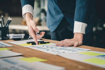 Obraz premium Businessman checking earnings documents at a desk in the office