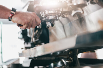 Process of preparing coffee on coffee machine in restaurant. Blurred background