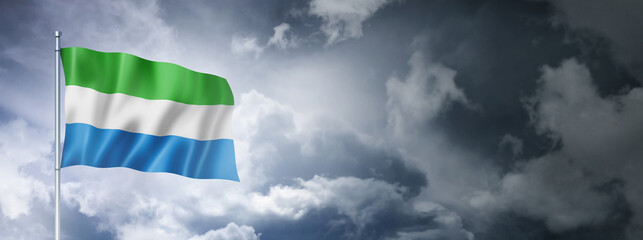 Sierra Leone flag on a cloudy sky