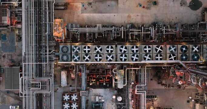 Aerial top view of oil refinery plant production line with metal pipes and equipment in industry zone