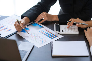Business adviser analyzes financial figures by checking documents. marketing plan using statistical data sheet at work. Data analysis, roadmap, marketing, accounting, auditing.