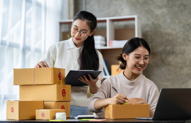 Starting a small business, SME owners, Asian female entrepreneurs help to list products. and are very happy to receive a large order of SME online business ideas