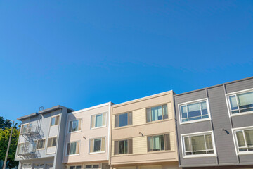 Complex box houses in San Francisco, California with picture windows