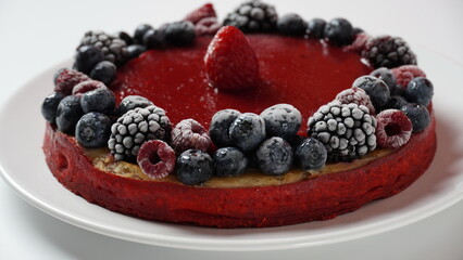Berry jelly cake with frozen strawberries, blueberries, raspberries