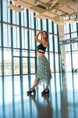 Posing of a woman terrace of a viewpoint of the city in a glass building