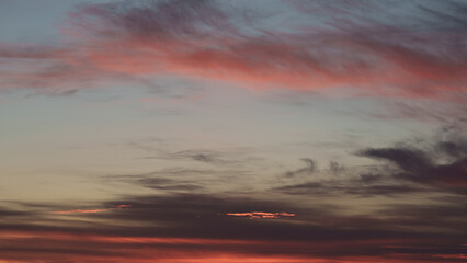 Soft clouds with warm light during summer sunset