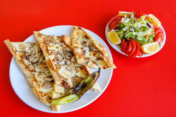 Kiymali pide. Turkish pide with minced meat. Turkish pizza mince pita Pide on white background. Etli ekmek. Kusbasi kasarli, kiymali kasarli, kiymali yumurtali, Bafra, Trabzon, Kusbasili pide.