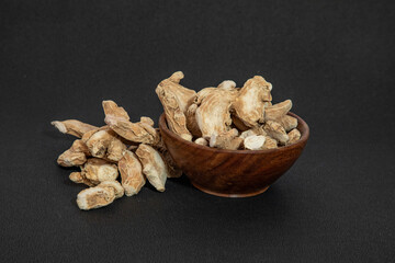 Organic ayurvedic whole dry ginger or sonth adrak on black background
