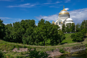 The Naval Cathedral in the city of Kronstadt near St. Petersburg in summer against the background of a blue sky with clouds