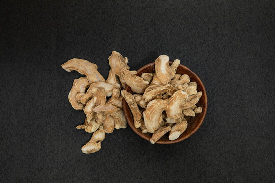 Organic ayurvedic whole dry ginger or sonth adrak on black background