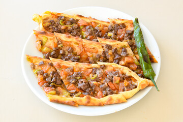Kiymali pide. Turkish pide with minced meat. Turkish pizza mince pita Pide on white background. Etli ekmek. Kusbasi kasarli, kiymali kasarli, kiymali yumurtali, Bafra, Trabzon, Kusbasili pide.