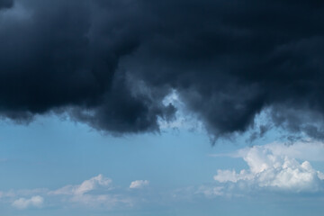 Blue dramatic sky with dark ominous thunderclouds