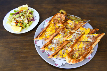 Kiymali pide. Turkish pide with minced meat. Turkish pizza mince pita Pide on white background. Etli ekmek. Kusbasi kasarli, kiymali kasarli, kiymali yumurtali, Bafra, Trabzon, Kusbasili pide.