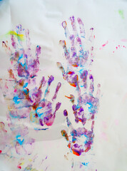 Paint with my hands on white paper.