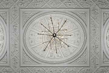 Tracery decorative ceiling with elegant retro chandelier