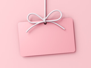 Minimal pink pastel color gift card hanging with white rope bow isolated on pink pastel color background with shadow sweet love romance minimal conceptual 3D rendering