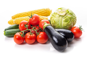 Vegetables. Tomatoes, corn, cabbage and eggplant on a white background. Isolate