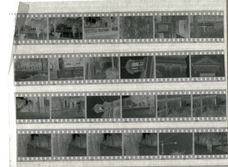 stack of old negative photographic films in a sheet of parchment